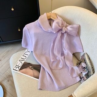 Áo sơ mi ren nơ lớn phối màu xanh tím, dáng slim-fit vai ngắn, size lớn phù hợp xu hướng xuân hè ngọt ngào