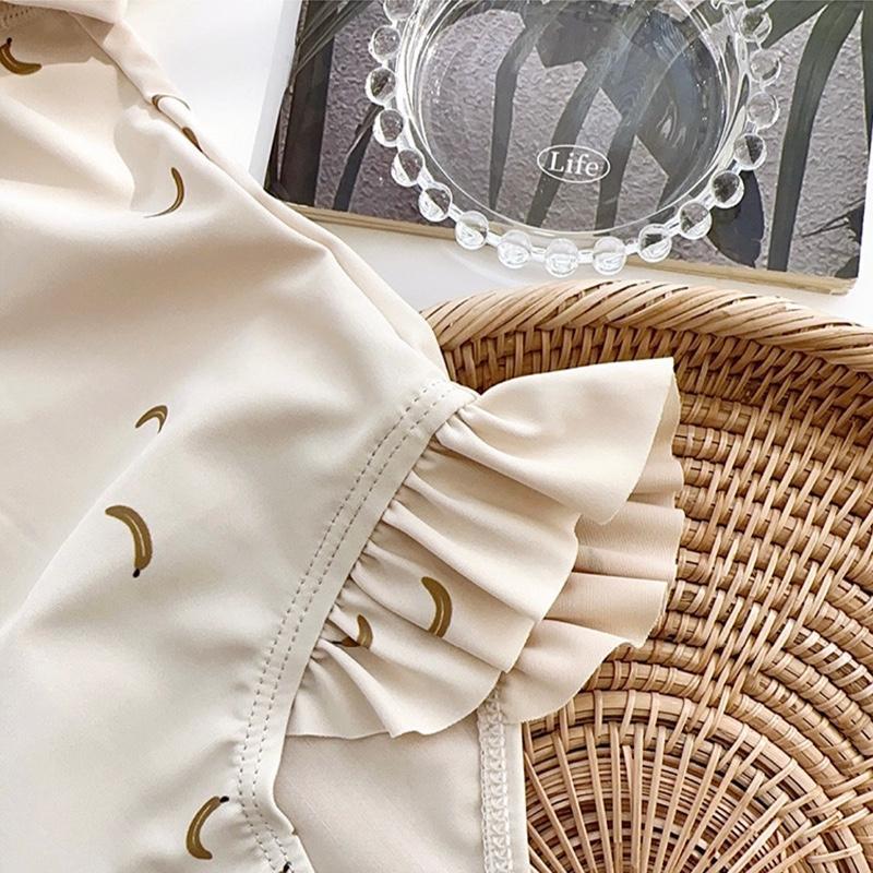 [Hàng QC] Bikini liền thân dài tay bé gái họa tiết chuối, đồ bơi một mảnh kéo khóa cho bé chất liệu 2 lớp vải hè 2026