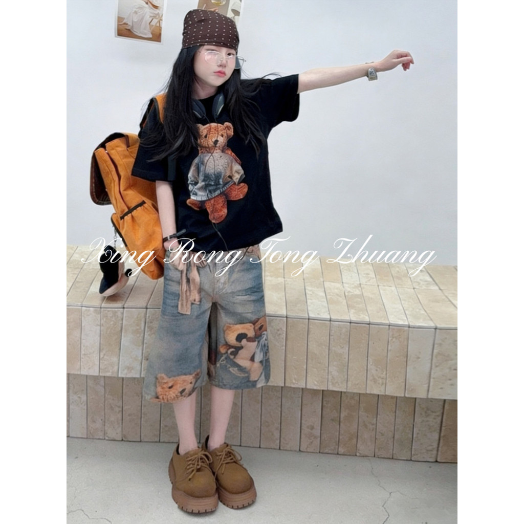Quần giữa Denim bé gái mùa hè 2026 Phong cách mới cho trẻ em Quần short in hình gấu kỹ thuật số