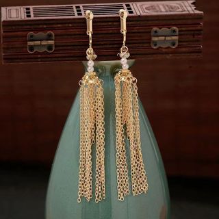 Cô dâu - Mũ đội đầu sang trọng có tua rua và hình phượng hoàng vàng, phù hợp trang phục cưới truyền thống Trung Quốc