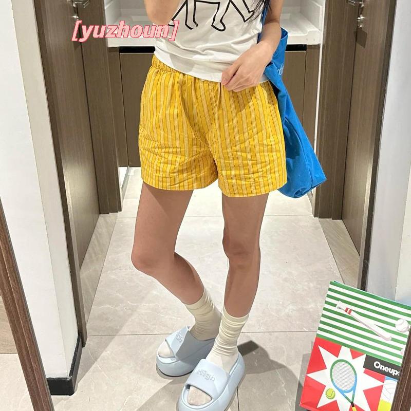 Quần short nữ màu sọc vàng, dáng rộng, eo cao, phù hợp thời trang thể thao mùa hè