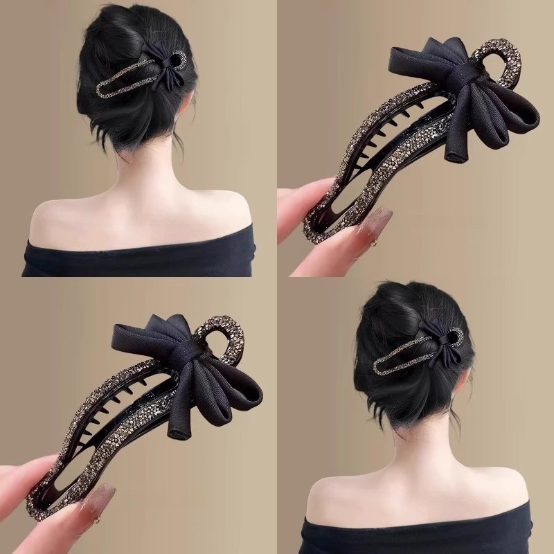 Kẹp tóc phong cách Hàn Quốc với nơ mỏ vịt lấp lánh pha lê, phù hợp tạo kiểu updo thanh lịch.