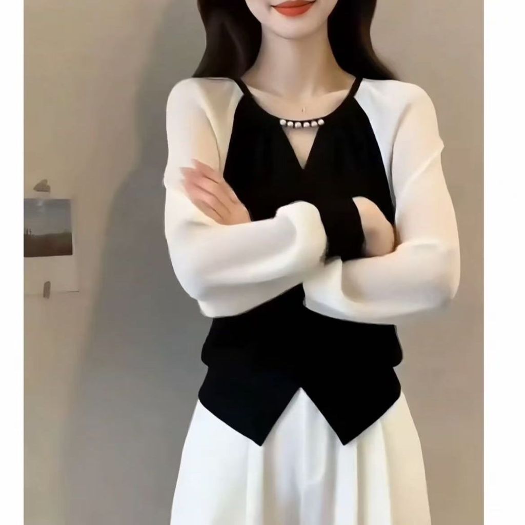 Áo sơ mi dài tay phong cách xuân thu mới, tay áo voan và thiết kế slim-fit giúp trông gọn gàng hơn