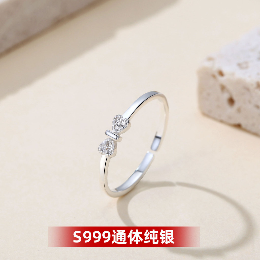Nhẫn đính kim cương hình nơ bạc S999
