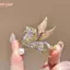 Áo len nữ thời trang với phụ kiện pha lê cánh ngựa thổ cẩm, phù hợp mọi dịp
