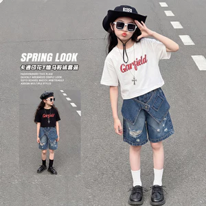 Quần short Denim mùa hè cho bé gái 2026 Phong cách mới Thiết kế rách trẻ em Cảm giác quần năm điểm