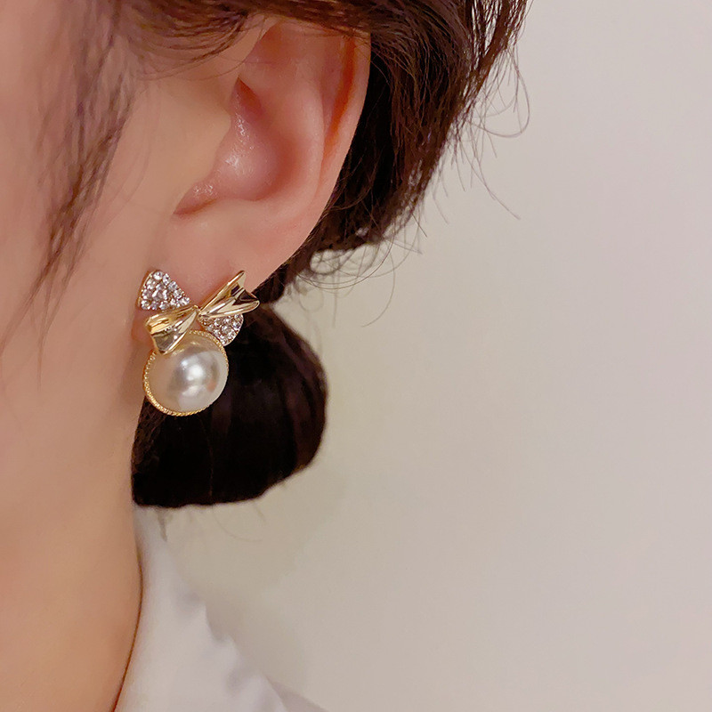 Bông tai ngọc trai nơ dễ thương kim bạc S925
