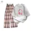 bộ đồ nữ Quần caro ống rộng màu hồng+ Áo phông hình chiếc tai nghe-quanao94