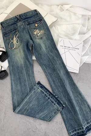 Quần jeans ống loe thêu cạp cao