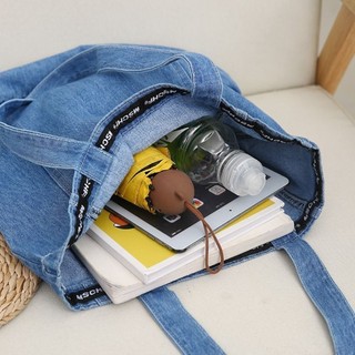 Túi denim thiết kế thích hợp nhẹ nhàng và lười biếng Túi đeo vai đa năng mới 2026 Túi vải canvas sứ