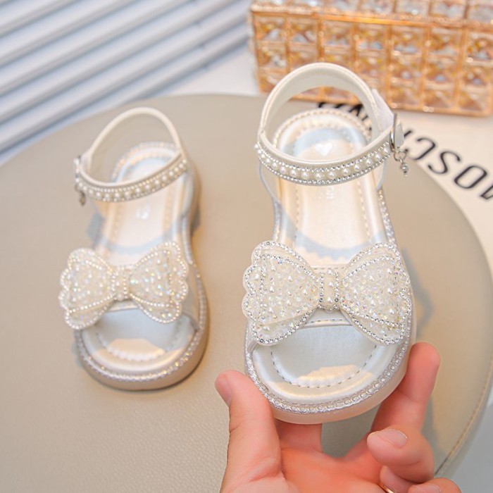 Giày Sandal Đế Mềm Nơ Pha Lê Giày Bé Gái Ngọc Trai Giày Công Chúa Giày Đi Biển Hợp Thời Trang