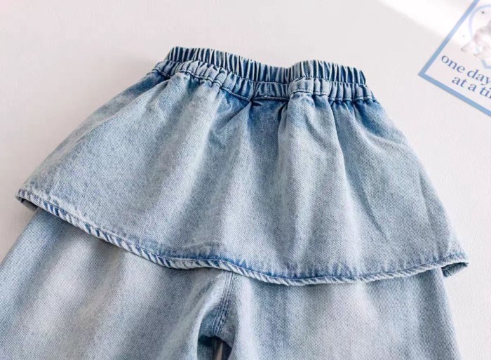 Quần jeans bé gái mùa xuân mới phong cách Hàn Quốc trẻ em quần rắm rèm quần ống rộng quần ống