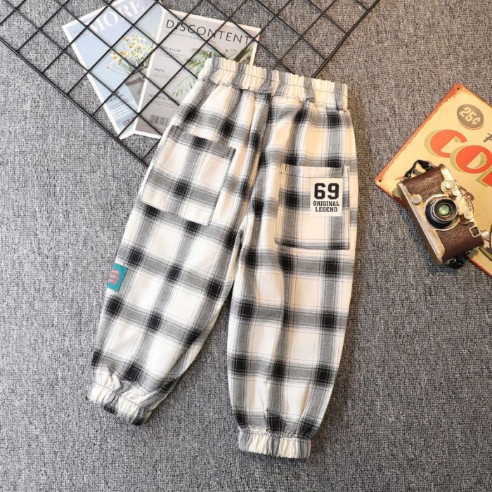 Quần kẻ sọc xuân thu bé trai mới quần legging rộng rãi cho trẻ em từ trung niên trở lên quần