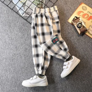 Quần kẻ sọc xuân thu bé trai mới quần legging rộng rãi cho trẻ em từ trung niên trở lên quần
