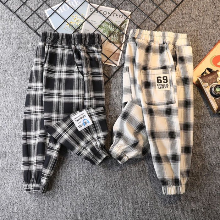 Quần kẻ sọc xuân thu bé trai mới quần legging rộng rãi cho trẻ em từ trung niên trở lên quần