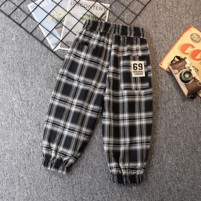 Quần kẻ sọc xuân thu bé trai mới quần legging rộng rãi cho trẻ em từ trung niên trở lên quần