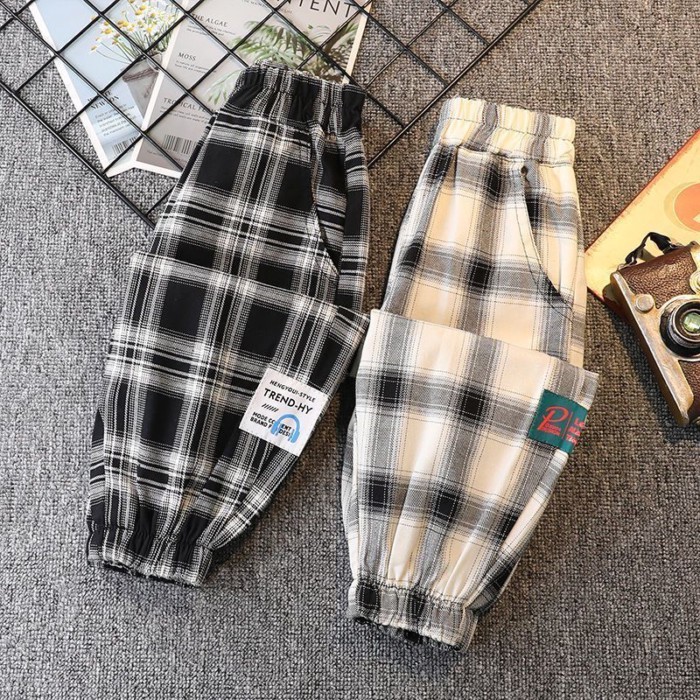 Quần kẻ sọc xuân thu bé trai mới quần legging rộng rãi cho trẻ em từ trung niên trở lên quần