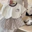Bộ đồ mùa hè bé gái Hàn Quốc mới hoạt hình phong cách Hồng Kông áo thun ngắn tay + quần short