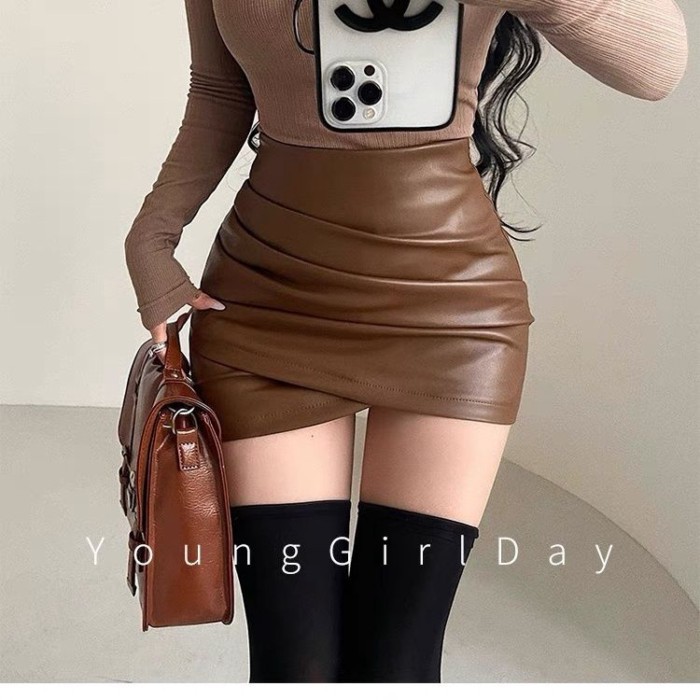 Váy xếp ly màu đen không đều dành cho nữ mùa thu đông cao cấp bó sát hot girl da pu hông váy ngắ
