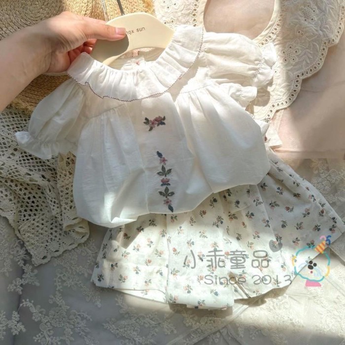 Nhẹ dễ mặc Áo mùa hè bé gái phong cách Hàn Quốc Áo thun babydoll tay phồng ngắn tay thêu ve á