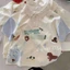 Áo thun trẻ em cotton nguyên chất phong cách graffiti hoạt hình ve áo ngắn tay mùa hè thời tr