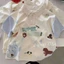 Áo thun trẻ em cotton nguyên chất phong cách graffiti hoạt hình ve áo ngắn tay mùa hè thời tr