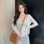 Bộ hai dây sọc treo phong cách Hàn Quốc dành cho nữ mùa hè mới màu trơn áo cardigan chống nắn