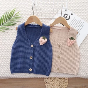 Áo len trẻ em xuân thu áo len dệt kim màu trơn mới cho bé trai và bé gái, áo vest bé mặc bên