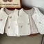 Áo vest trẻ em xuân thu Hàn Quốc chần bông thêu gấu ô liu vest hai mặt cotton nguyên chất áo