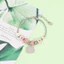 Chủ đề phụ kiện tay với hợp kim mạ điện và các yếu tố hoạt hình để tặng quà