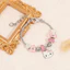 Chủ đề phụ kiện tay với hợp kim mạ điện và các yếu tố hoạt hình để tặng quà