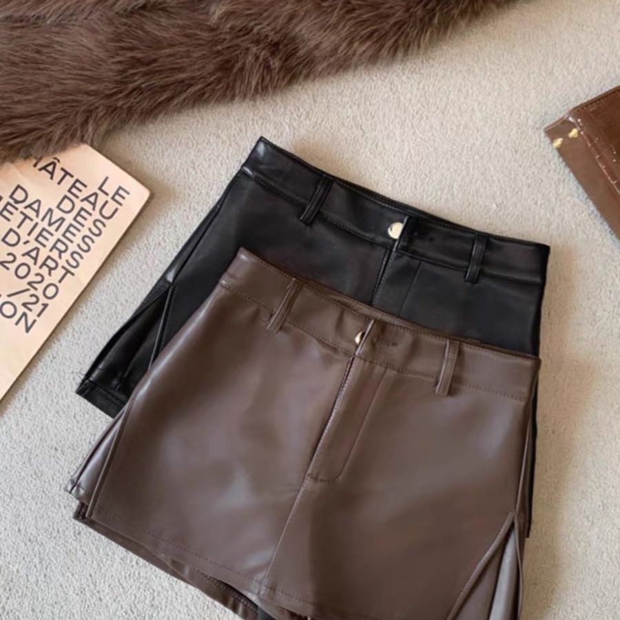 Váy chữ A màu đen cao cấp, chất liệu da PU mềm mại, thiết kế cut eo trendy cho thu đông