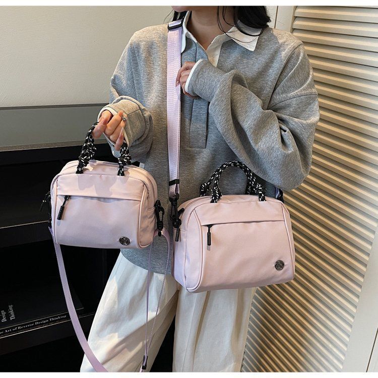 Ba lô Nylon Chống thấm nước Dung tích lớn Học sinh Schoolbag Cotton Lót Niche Design Ba lô