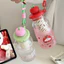 Bình Nước Nhựa Nắp Táo 600ml Siêu Cute – Có Lõi Lọc Tiện Lợi