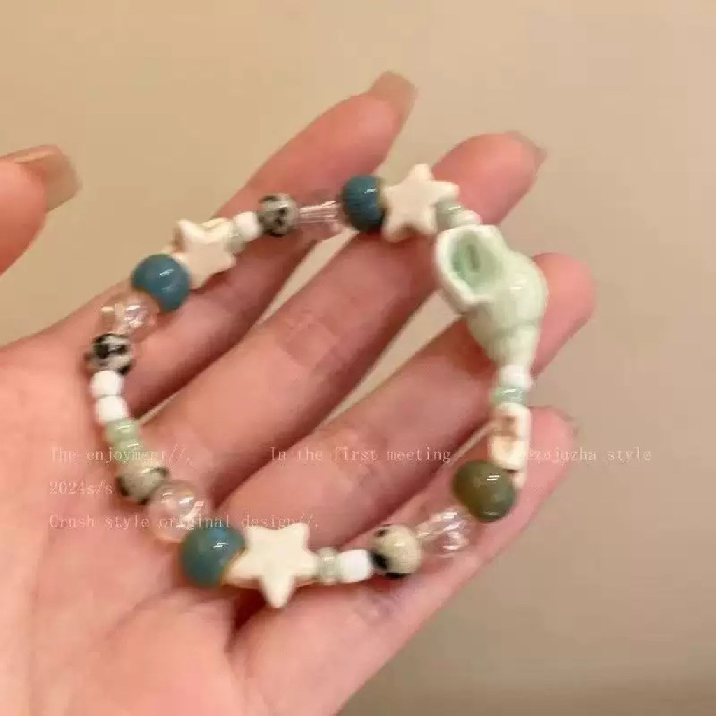 Vòng tay may mắn- vòng tay ốc xà cừ- vòng tay hạt gốm