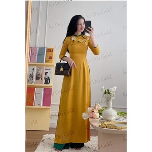 áo dài màu vàng kết hoa duy băng nữ tính trẻ trung