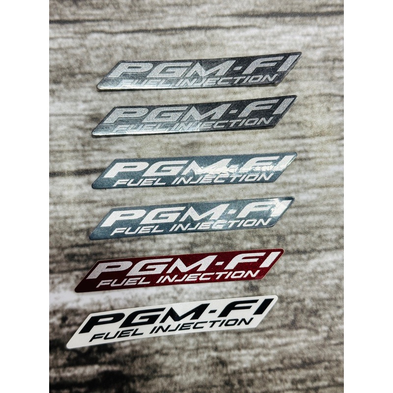 Tem chữ PGM-Fi Future/ 1 bên Zin chính hãng Honda cao cấp(1cm*7,5cm)