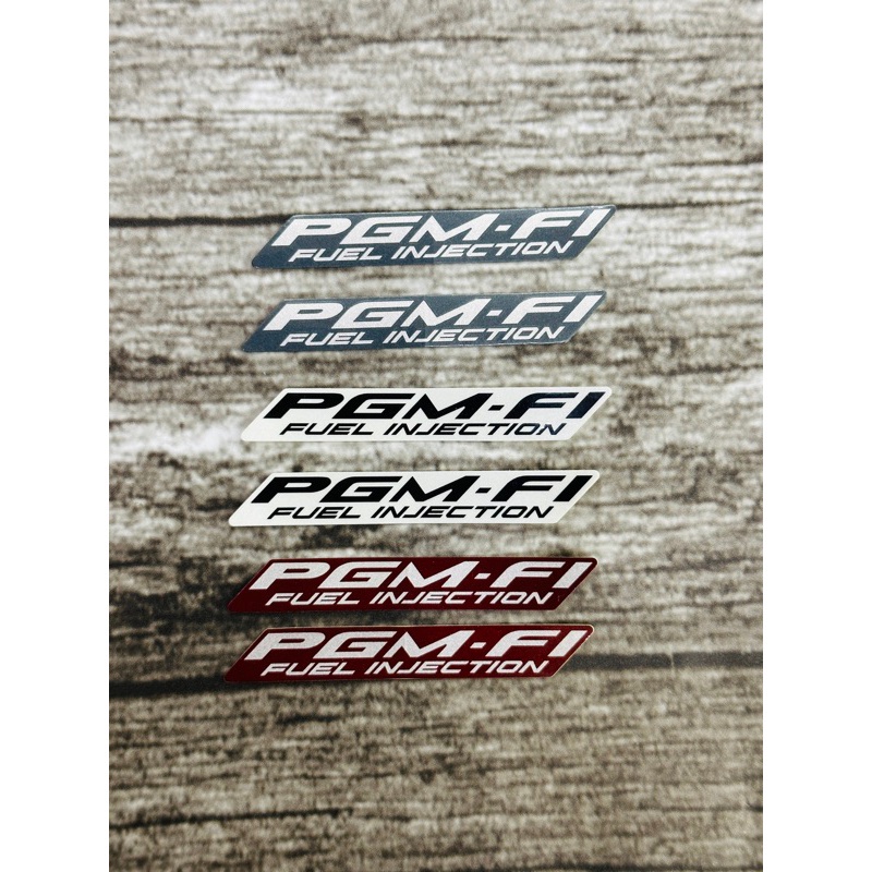 Tem chữ PGM-Fi Future/ 1 bên Zin chính hãng Honda cao cấp(1cm*7,5cm)