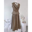 Set nâu áo cổ thuyền đổ sau dáng peplum xoè + chân váy tùng xoè có túi