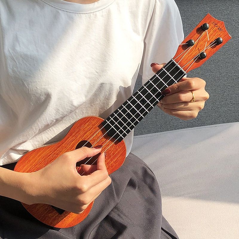 Product image Đàn Ukulele mô phỏng chơi được xuyên biên giới, đàn guitar cho trẻ em, dụng cụ giáo dục cho người mới bắt đầu, quà tặng 