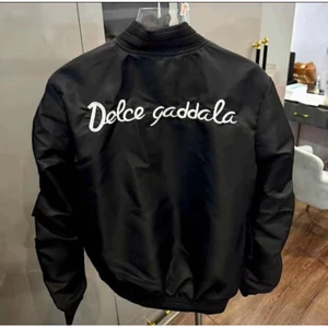 Áo khoác gió thêu dcel sau lưng bản tay rúm bo gân dành cho nam nữ from unisex Hot Trend 2025