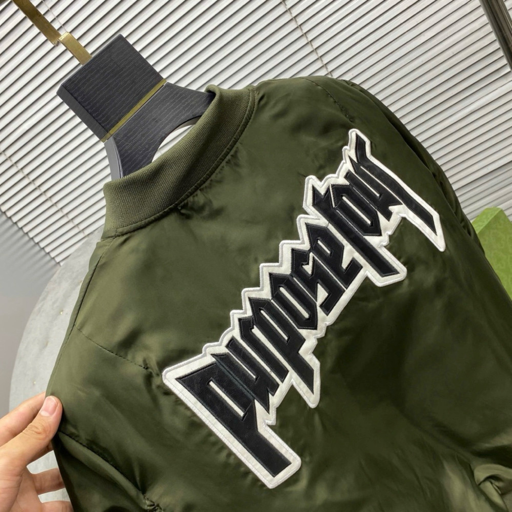 Áo khoác bomber gió unisex màu đen, thêu chữ da Purpose Tour, lưng có túi khóa tay trần, bông 3 lớp AK121P. Boy Phố 2025