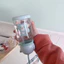 Bình nước 600ml họa tiết hoạt hình có sừng dễ thương, kèm dây đeo cho bé