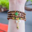 Vòng trầm tốc thường 108 hạt 6ly mix charm túi tiền và cỏ 4 lá ,giành cho nữ,thanh lịch dễ thương.