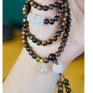 Chuỗi trầm hương sánh chìm 6ly 108 hạt mix ngũ điếu màu trắng và túi tiền 10 ka-Trầm hương Hội an.