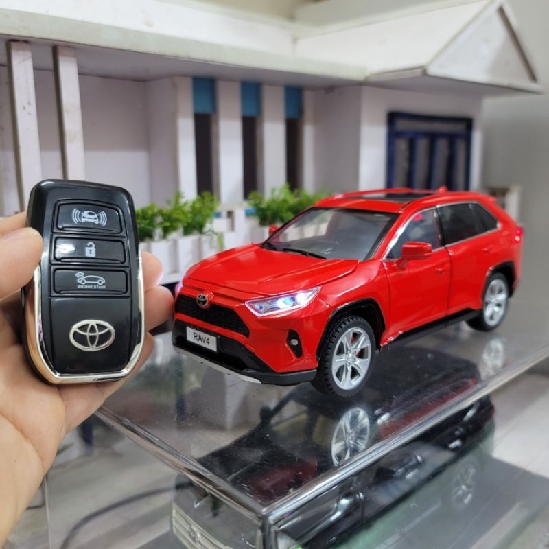 Mô hình xe Toyota RAV4 có Remote tỉ lệ 1/24 có đèn, có nhạc và chạy cót ...