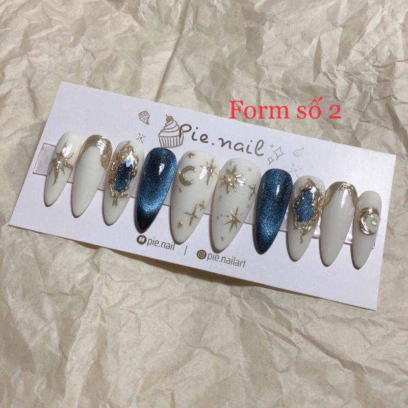 220. nailbox trắng kem mix mắt mèo xanh