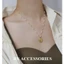 Dây chuyền nữ titan xích mảnh ngọc trai nhân tạo phối mặt oval chạm nổi hình hoa linh lan vintage không gỉ WN2464