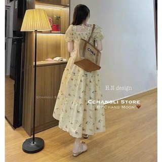 Đầm dài chất sốp cổ vuông tay phồng dây cột nơ sau lưng với họa tiết hoa nhí dáng váy dài thanh lịch