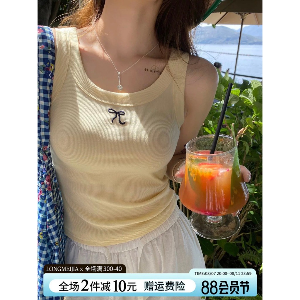 Áo ba lô cổ rộng dáng ôm In hình Nơ nhỏ JULY fashion2023, Áo ba lỗ chất gân tăm lụa mềm mại, co giãn 4 chiều.